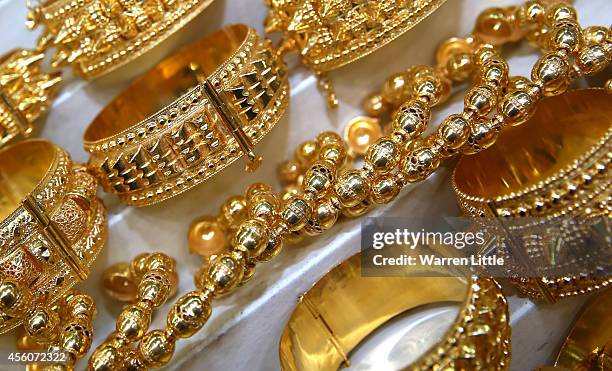 Golf jewllery is pictured at the Dubai Gold Souk on September 25, 2014 in Dubai, United Arab Emirates.