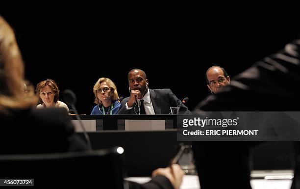 Internet giant Google Chief Legal Officer David Drummond listens flanked by panel members, Le Monde Editorial Director Sylvie Kauffmann , CEE Trust...