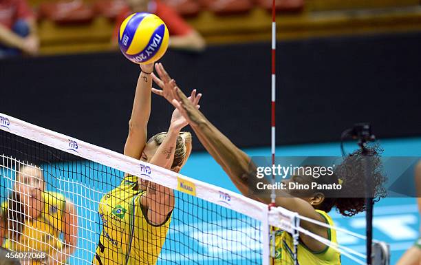 Fernanda Rodrigues and Thaisa Menezes of Brazil during triest to save a spike against the FIVB Women's World Championship pool B match between Canada...