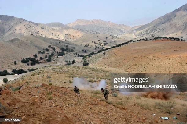 Afghan security personnel retaliate against Taliban insurgents during an anti-Taliban operation in Dur Baba district near the Pakistan-Afghanistan...