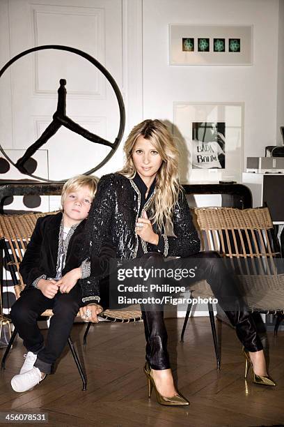 Interior designer Sarah Lavoine and son Roman are photographed for Madame Figaro on October 11, 2013 in Paris, France. Sarah: Jacket, blouse and...