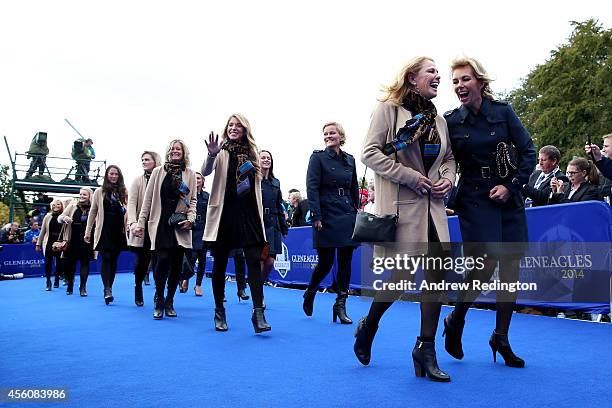 Hilary Watson , wife of United States team captain Tom Watson talks to Allison McGinley , wife of Europe team captain Paul McGinley prior to the...