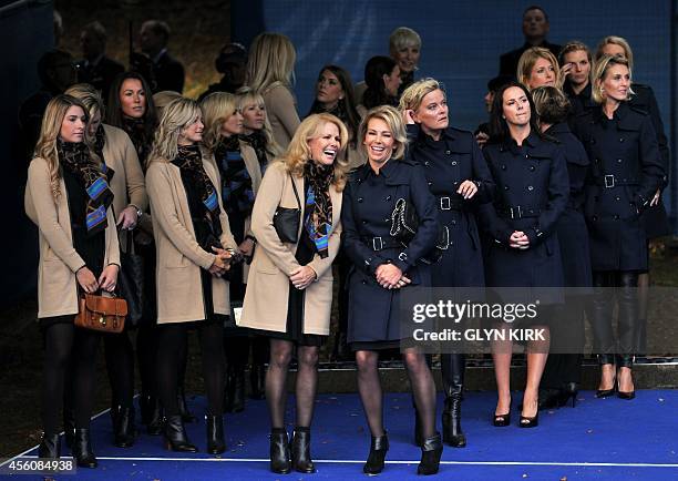 Hilary Watson , wife of United States team captain Tom Watson, talks to Allison McGinley, wife of Europe team captain Paul McGinley, before the start...