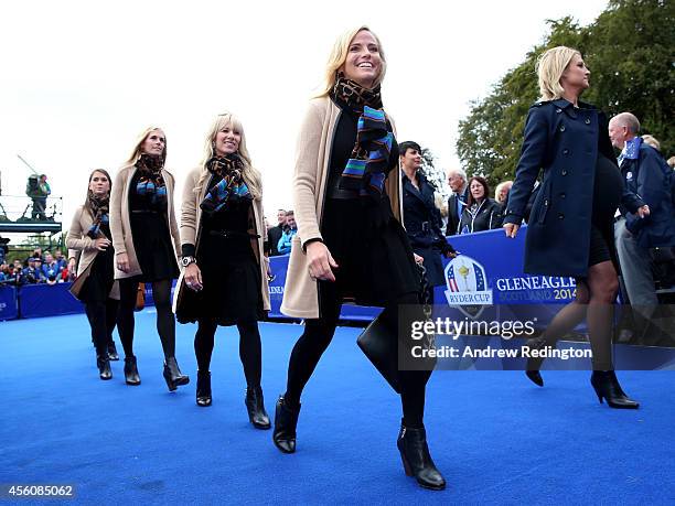 Amy Mickelson of the United States smiles as she enters the arena prior to the Opening Ceremony ahead of the 40th Ryder Cup at Gleneagles on...