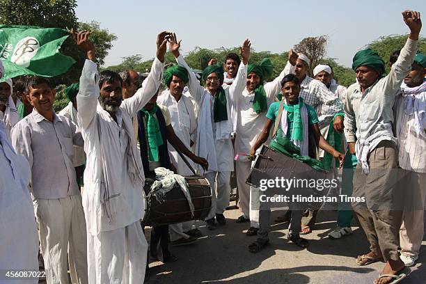 Supporters arrive on tractors for a rally organised to mark the 100th birth anniversary of his father and late Deputy Prime Minister Devi Lal on...