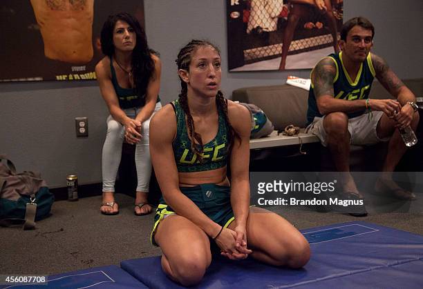 Team Pettis fighter Jessica Penne talks with her teammates after her victory over team Melendez fighter Lisa Ellis during filming of season twenty of...