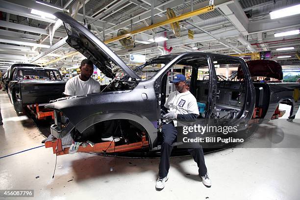 Chrysler Ram 1500 truck goes through the assembly line at the Warren Truck Assembly Plant September 25, 2014 in Warren, Michigan. The plant...