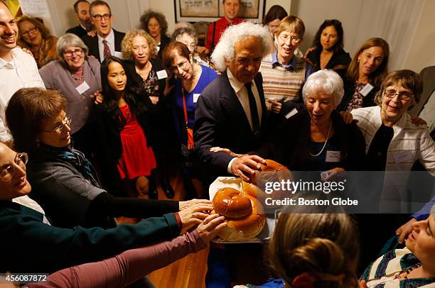 Congregation Eitz Chayim join together for the kiddush during their observance of Rosh Hashana in Cambridge, Massachusetts September 24, 2014.