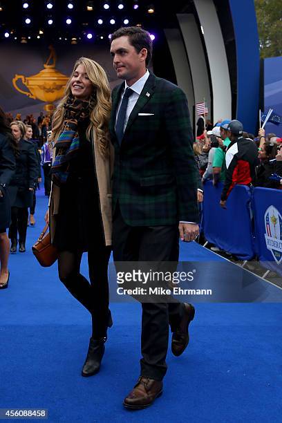 Keegan Bradley of the United States and partner Jillian Stacey leave the arena after the Opening Ceremony ahead of the 40th Ryder Cup at Gleneagles...