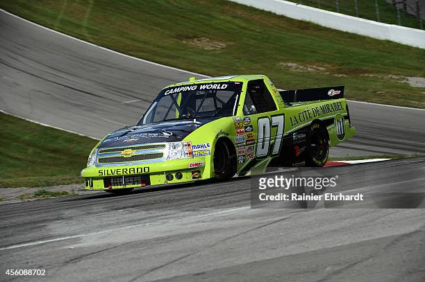 Roy Courtemanche Jr., driver of the La Cite DeMaribel Chevrolet, drives during the NASCAR Camping World Truck Series Chevrolet Silverado 250 on...