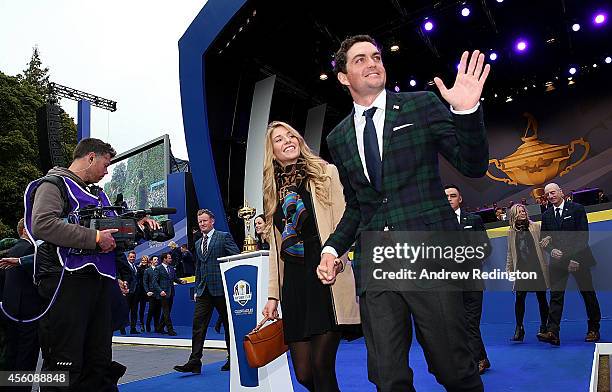 Keegan Bradley of the United States and partner Jillian Stacey leave the arena after the Opening Ceremony ahead of the 40th Ryder Cup at Gleneagles...