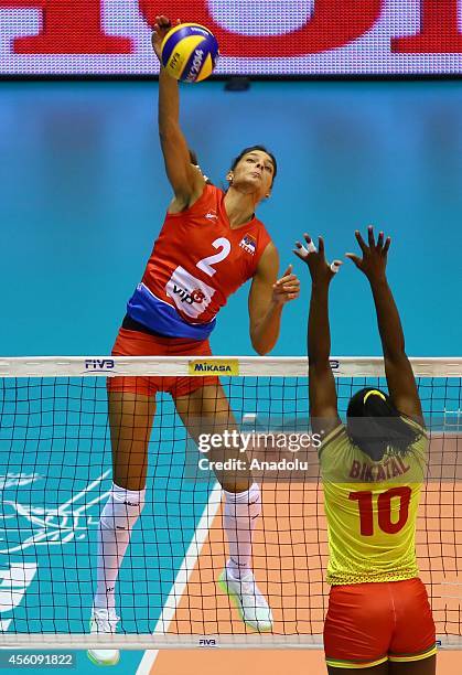 Bikatal of Cameroon in action against Brakocevic of Serbia during the 2014 FIVB Volleyball Women's World Championship Group B volleyball match...