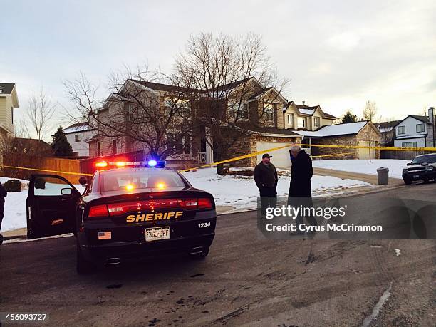 Emergency personnel surround the suspected gunman's family home in Highlands Ranch, Colo. After a reported shooting at Arapahoe High School in...