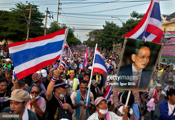 Thailand rattled by political turmoil. Anti-government protesters march outside the Government House in Bangkok, Thailand. Thai Prime Minister...