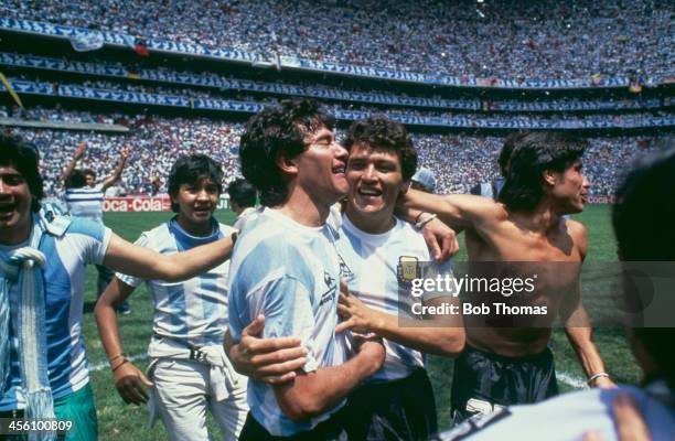 Argentina's Jorge Burruchaga is congratulated by Nestor Clausen after scoring the World Cup Final winning goal against West Germany at the Azteca...