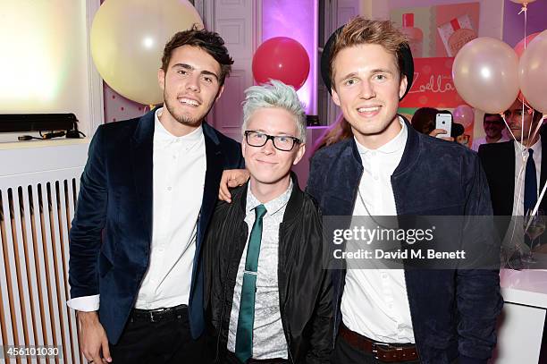 Alfie Deyes, Tyler Oakley and Marcus Butler attend YouTube phenomenon Zoe Sugg's launch of her debut beauty collection at 41 Portland Place on...