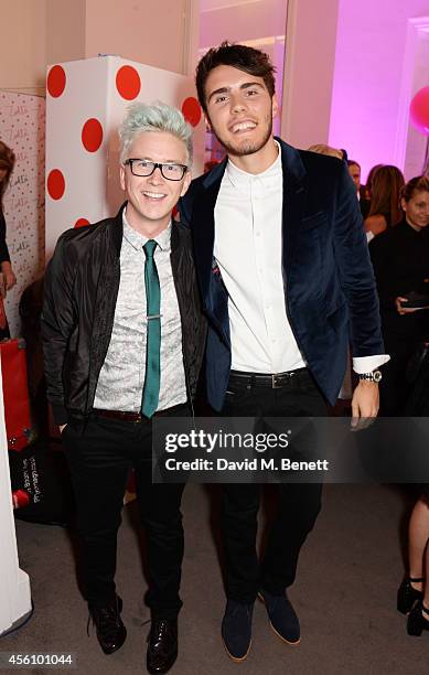 Tyler Oakley and Alfie Deyes attend YouTube phenomenon Zoe Sugg's launch of her debut beauty collection at 41 Portland Place on September 25, 2014 in...