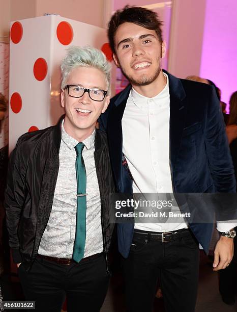 Tyler Oakley and Alfie Deyes attend YouTube phenomenon Zoe Sugg's launch of her debut beauty collection at 41 Portland Place on September 25, 2014 in...