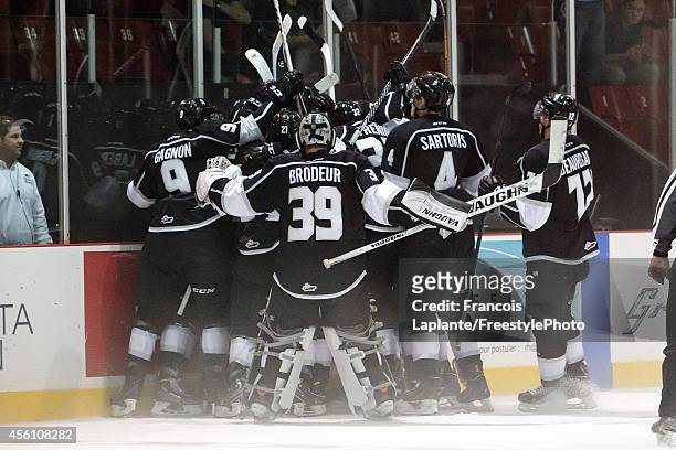 Anthony Brodeur of the Gatineau Olympiques gathers with teammates as they celebrate their overtime with over the Cape Breton Screaming Eagles on...