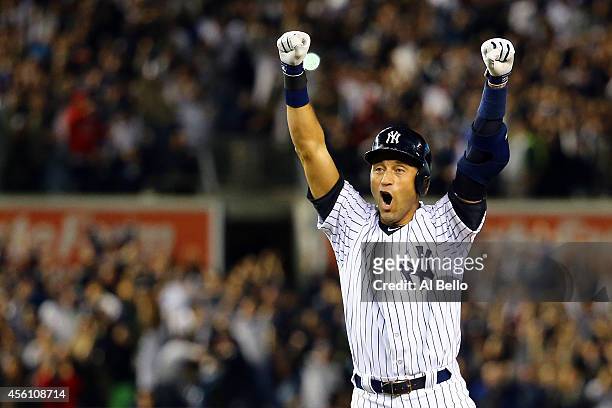 Derek Jeter of the New York Yankees celebrates after a game winning RBI hit in the ninth inning against the Baltimore Orioles in his last game ever...