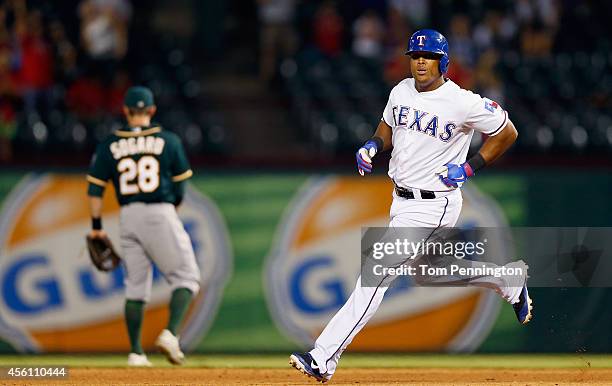 Adrian Beltre of the Texas Rangers rounds second base after hitting the game winning walk-off homerun against the Oakland Athletics in the bottom of...