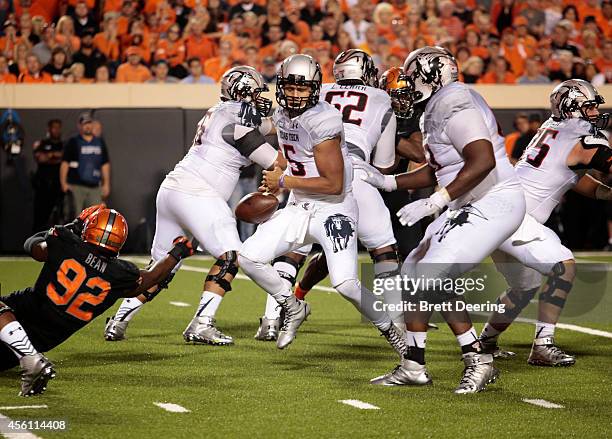 Quarterback Patrick Mahomes of the Texas Tech Red Raiders fumbles against the Oklahoma State Cowboys September 25, 2014 at Boone Pickens Stadium in...