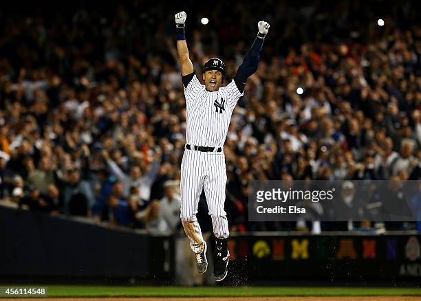 Derek Jeter of the New York Yankees celebrates after a game winning RBI hit in the ninth inning against the Baltimore Orioles in his last game ever...