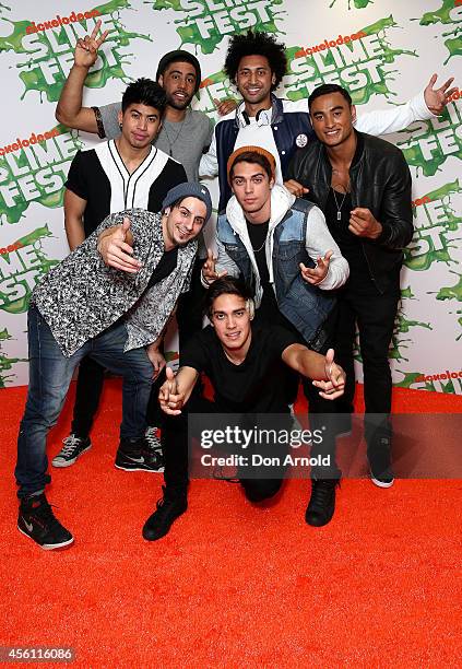 Krit Schmidt poses with Justice Crew on the media wall ahead of the Nickelodeon Slimefest 2014 evening show at Sydney Olympic Park Sports Centre on...