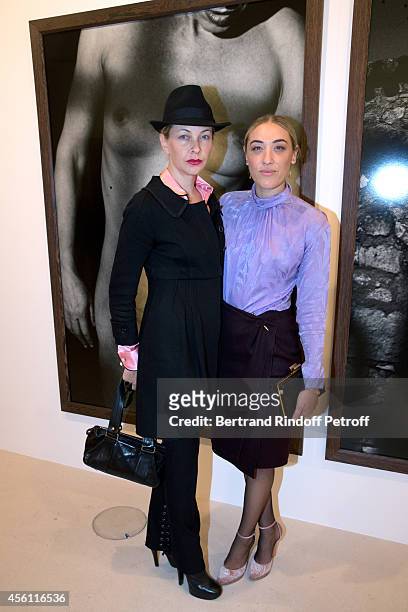 Melonie Hennessy Foster and Mia Moretti attend the 'Photographer Peter Lindbergh' Exhibition at Gagosian Gallery on September 25, 2014 in Paris,...