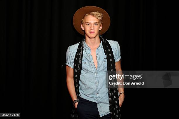 Cody Simpson poses on the media wall ahead of the Nickelodeon Slimefest 2014 evening show at Sydney Olympic Park Sports Centre on September 26, 2014...