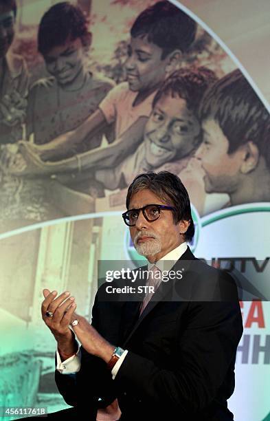 Indian Bollywood film actor Amitabh Bachchan poses during the launch of Dettol's 'Banega Swachh India' nationwide initiative, a five year programme...