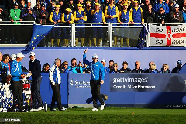 Rory McIlroy of Europe acknowledges the crowd on the 1st tee during the Morning Fourballs of the 2014 Ryder Cup on the PGA Centenary course at the...