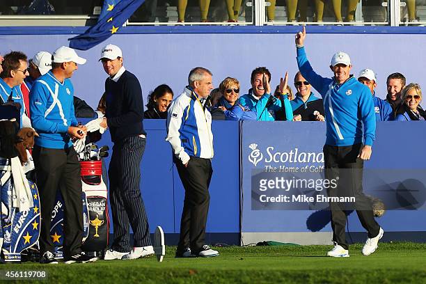 Rory McIlroy of Europe acknowledges the crowd with Europe team captain Paul McGinley, partner Sergio Garcia and Keegan Bradley of the United States...