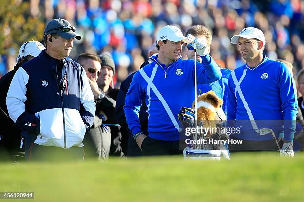 United States team captain Tom Watson looks at Rory McIlroy and Sergio Garcia of Europe on the 4th tee during the Morning Fourballs of the 2014 Ryder...