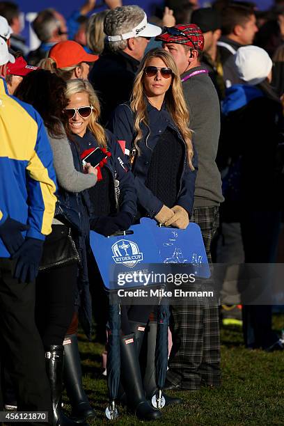 Amy Mickelson and Jillian Stacey follow Phil Mickelson and Keegan Bradley of the United States during the Morning Fourballs of the 2014 Ryder Cup on...