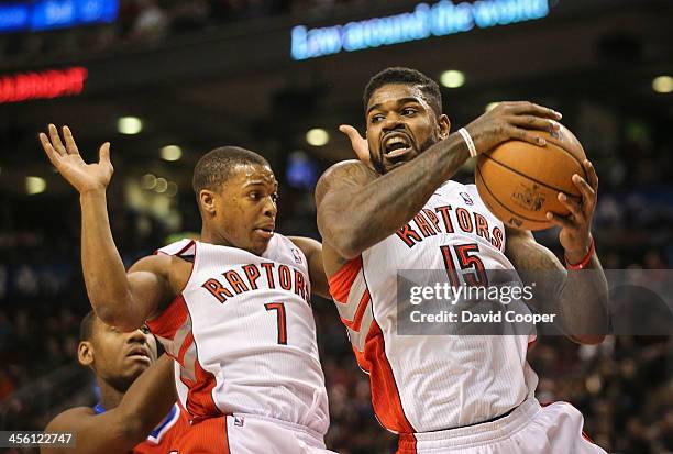 Toronto Raptors point guard Kyle Lowry backs off as Toronto Raptors power forward Amir Johnson come down with the defensive rebound as the...