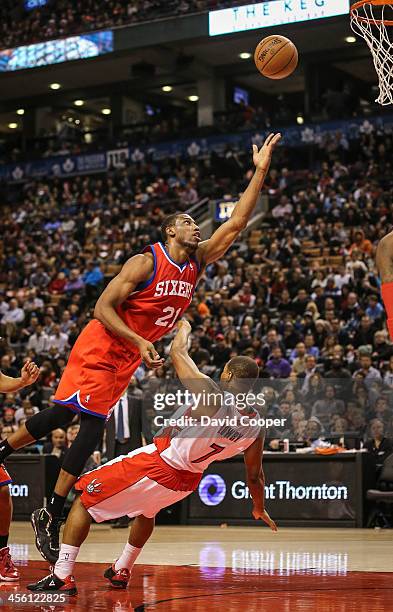 Toronto Raptors point guard Kyle Lowry receives an offensive foul from Philadelphia 76ers power forward Thaddeus Young as the Philadelphia 76ers take...