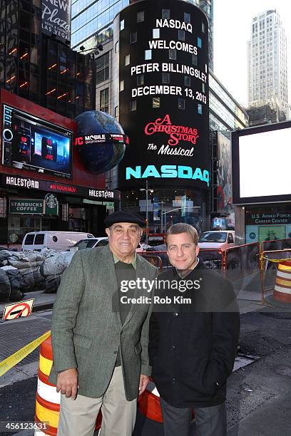 Dan Lauria and Peter Billingsley pose for a photo outside at NASDAQ MarketSite on December 13, 2013 in New York City.