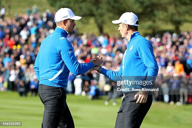 Henrik Stenson of Europe celebrates with Justin Rose on the 9th green during the Morning Fourballs of the 2014 Ryder Cup on the PGA Centenary course...