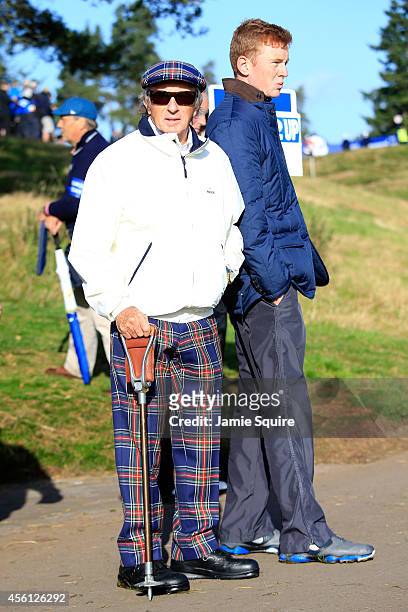 Former Formula 1 racing car driver Jackie Stewart watches during the Morning Fourballs of the 2014 Ryder Cup on the PGA Centenary course at the...