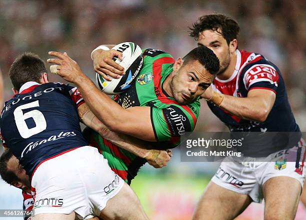 Ben Te'o of the Rabbitohs is tackled during the First Preliminary Final match between the South Sydney Rabbitohs and the Sydney Roosters at ANZ...