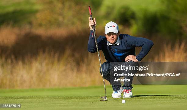 Keegan Bradley of the United States reads his putt during the fourball matches for the 40th Ryder Cup at Gleneagles, on September 26, 2014 in...