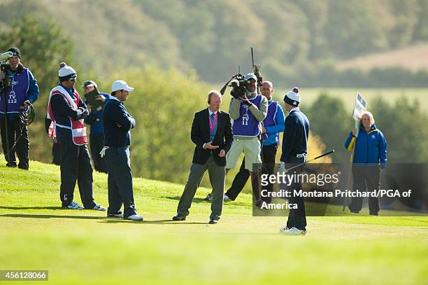 Jordan Spieth of the United States discusses a shot with a rules official on twelve during the fourball matches for the 40th Ryder Cup at Gleneagles,...