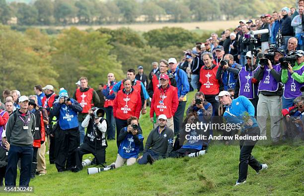 Rory McIlroy of Europe plays his second shot on the 18th hole during the Morning Fourballs of the 2014 Ryder Cup on the PGA Centenary course at the...