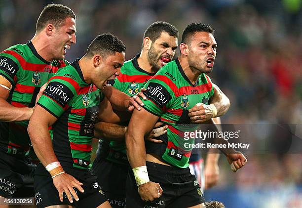 Ben Te'o celebrates his try with Sam Burgess, Dylan Walker and Greg Inglis during the First Preliminary Final match between the South Sydney...