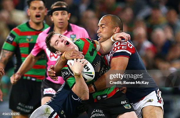 Luke Keary of the Rabbitohs is tackled high by Sam Moa of the Roosters during the First Preliminary Final match between the South Sydney Rabbitohs...