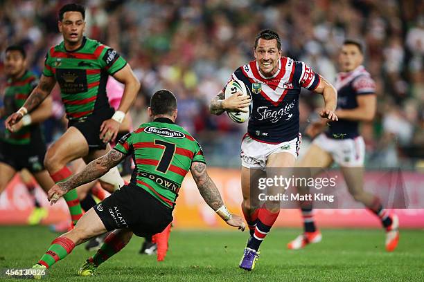 Mitchell Pearce of the Roosters makes a break during the First Preliminary Final match between the South Sydney Rabbitohs and the Sydney Roosters at...