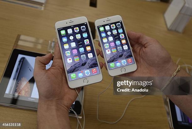 Customer holds the new products of Apple, iPhone 6 and iPhone 6 Plus, at an Apple Store in Madrid, Spain, on September 26, 2014. The iPhone 6 and...