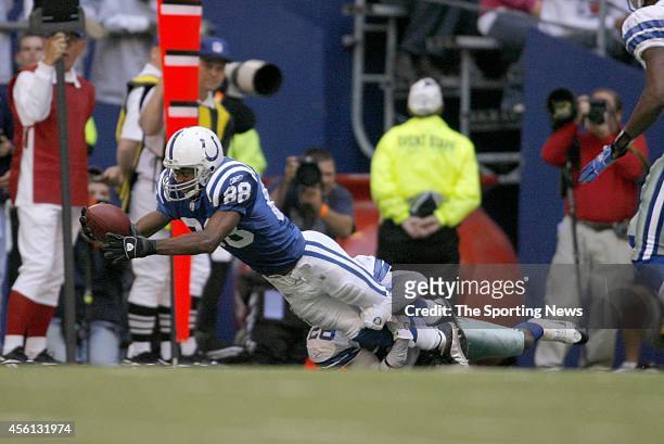 Robert Mathis of the Indianapolis Colts gets tackled during a game against the Dallas Cowboys on November 19, 2006 at Texas Stadium in Arlington,...