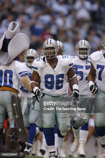 Marcus R. Spears and Kevin Burnett of the Dallas Cowboys taking the field before the start of a game against the Indianapolis Colts on November 19,...